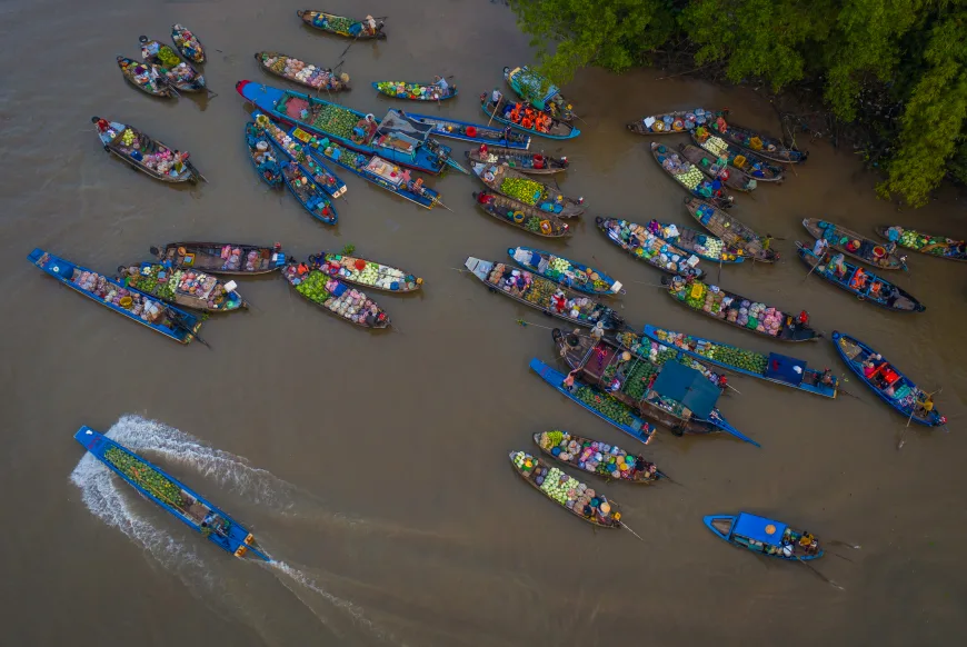 Cai Rang Floating Market at sunrise with boats on the Mekong